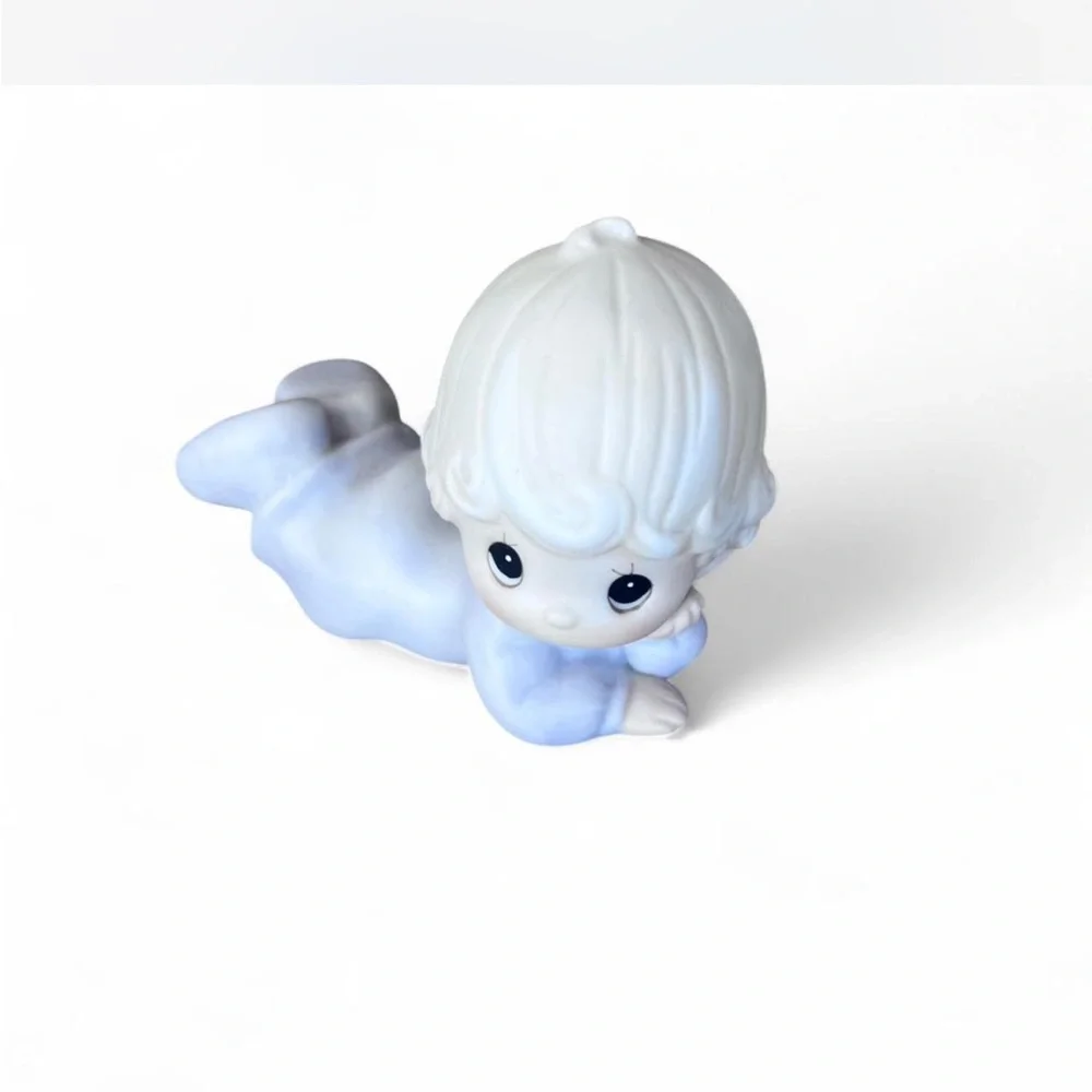 Adorable Precious Moments little girl lying down figurine in excellent condition